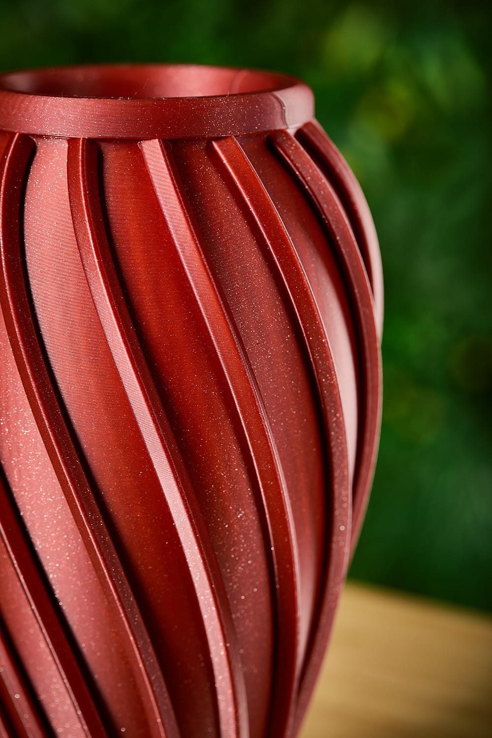 Ira Vase – Dark Red Detail Close-up of the Ira vase's spiralling fluted surface in dark red